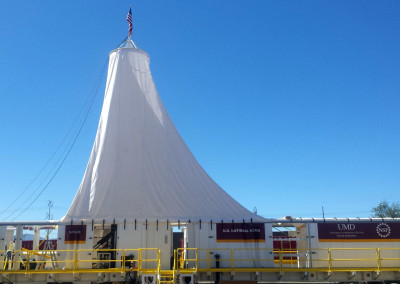 Canopy erected over the joined drill and rod skids.