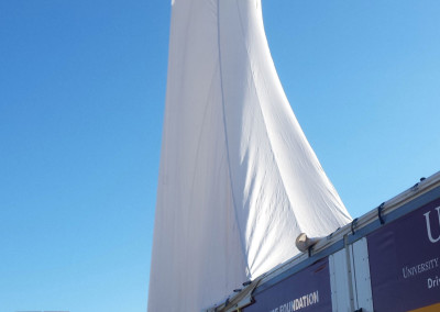 Canopy erected over the joined drill and rod skids.