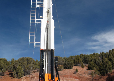 Operating the Boart Longyear LF230 drill rig at the test site.